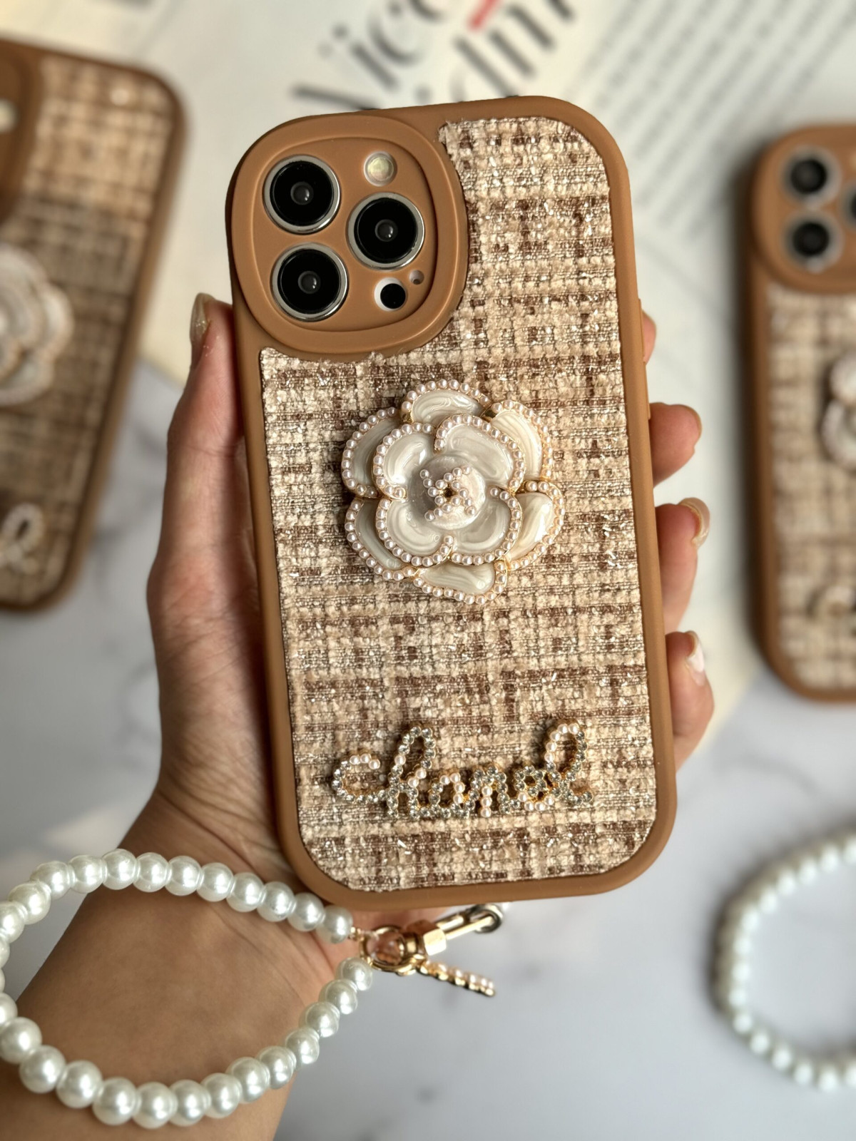 قاب موبایل آیفون شنل گل حصیری بند مرواریدی
