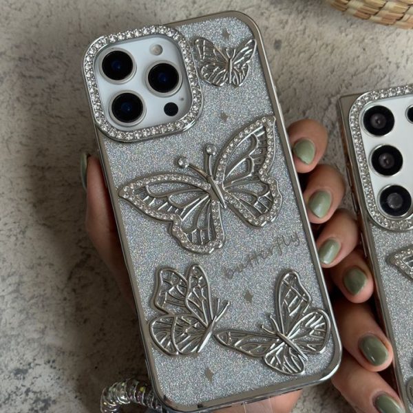 قاب موبایل ( آیفون - سامسونگ ) پروانه آموره نگین دار برجسته شاینی + بندست